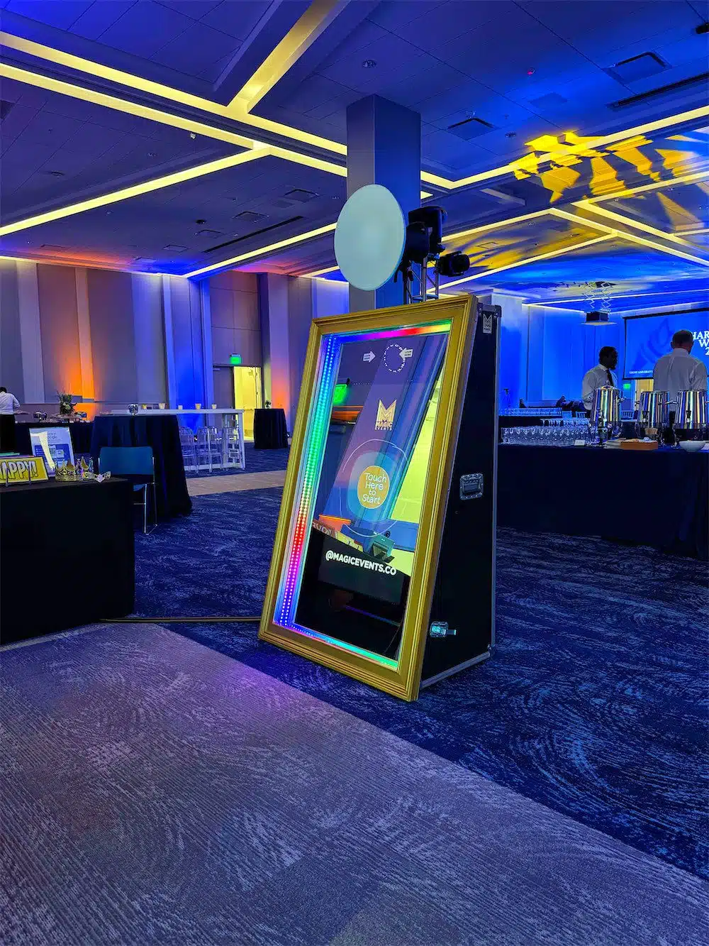 Luxury Magic Mirror Photo Booth at Emory Charter Week 2025 Magic Mirror Photo Booth setup at Emory Charter Week 2025, featuring a gold-framed interactive mirror with LED lighting, a professional camera setup, and a spacious event venue in Atlanta.